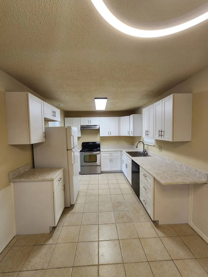 Full kitchen remodel — cabinets, counters, tile floor